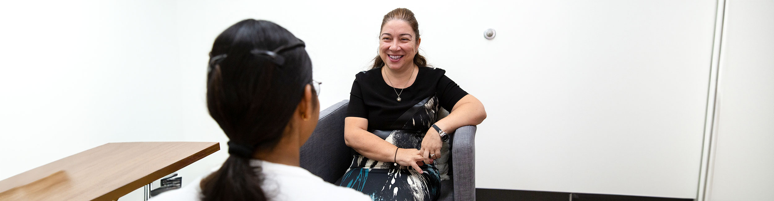 A counsellor talking with a student