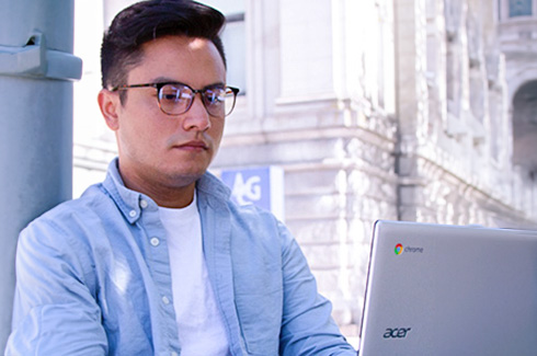 student studying on his laptop