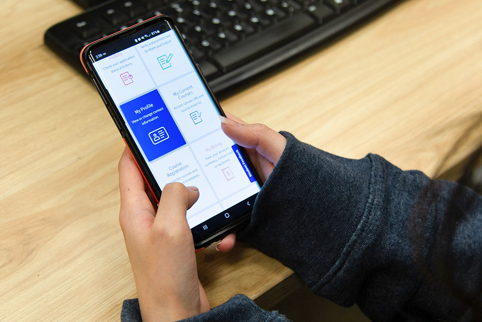 a student using myAC on their phone