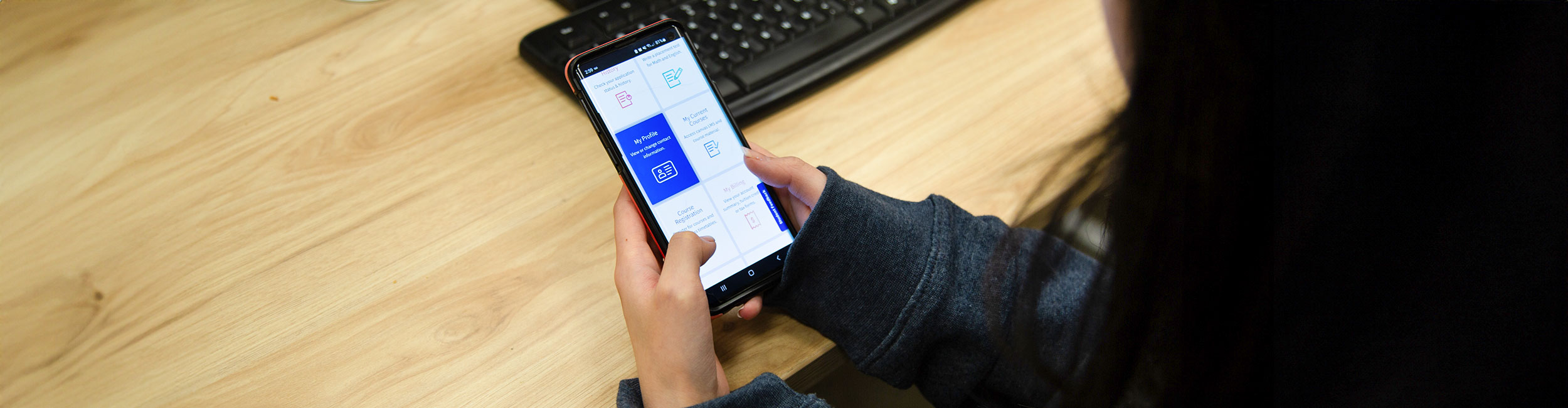 A student using the mobile myAC app