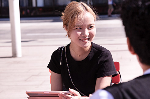 alexander-college-student-outside-studying-happy.jpg