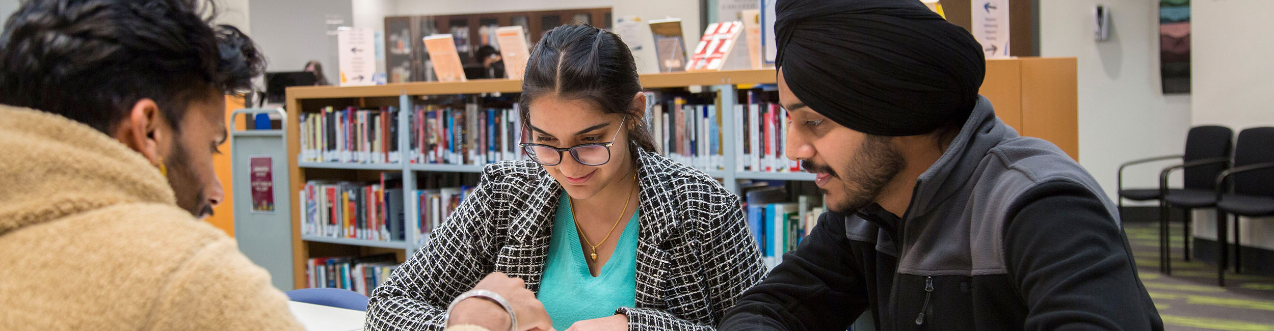 Alexander College students studying in the library