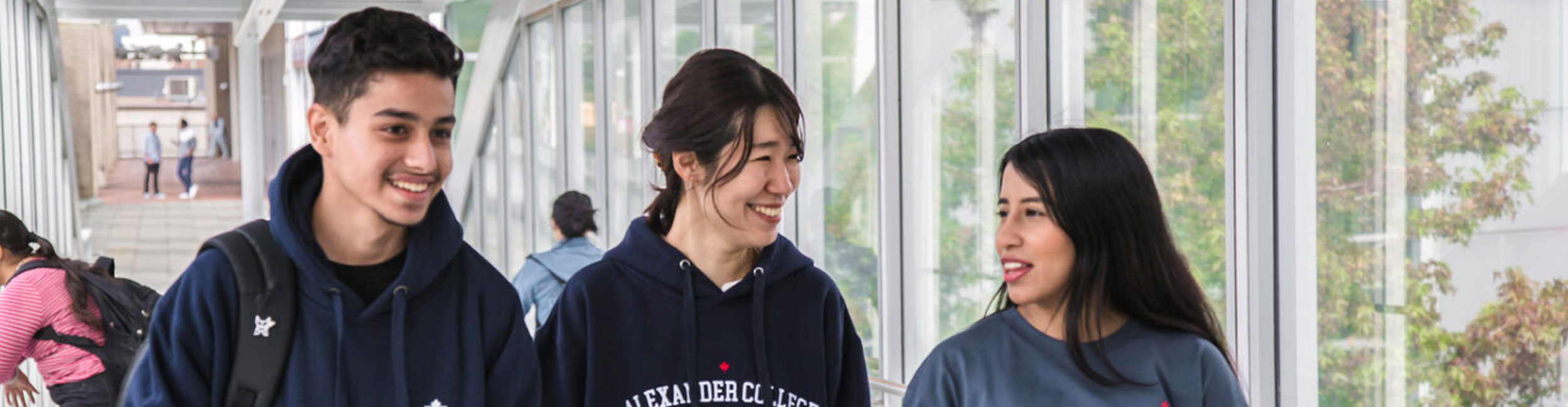 Three students walking and talking