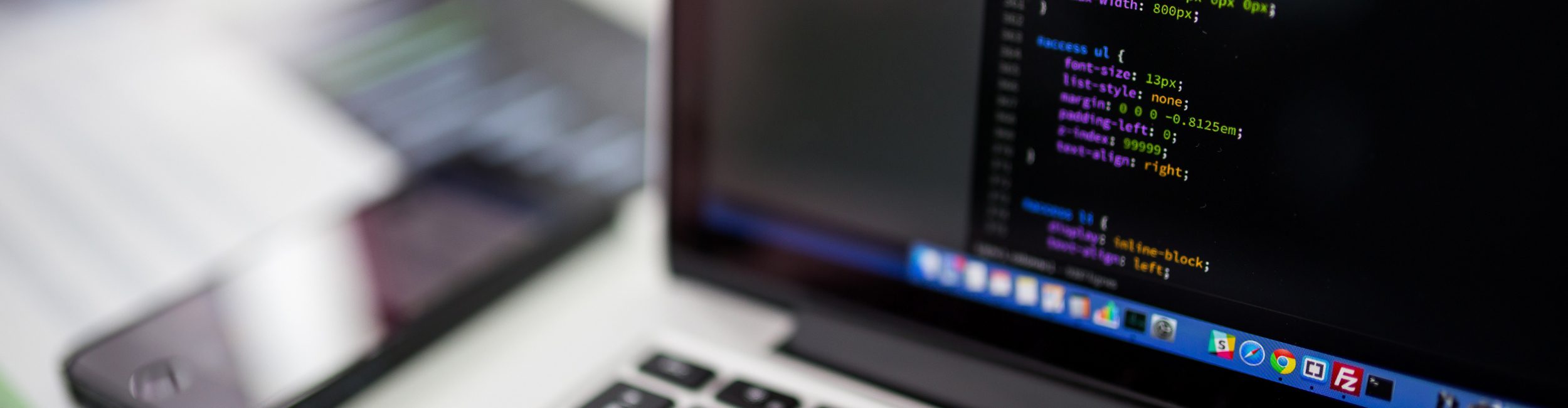 A laptop with a coding program open