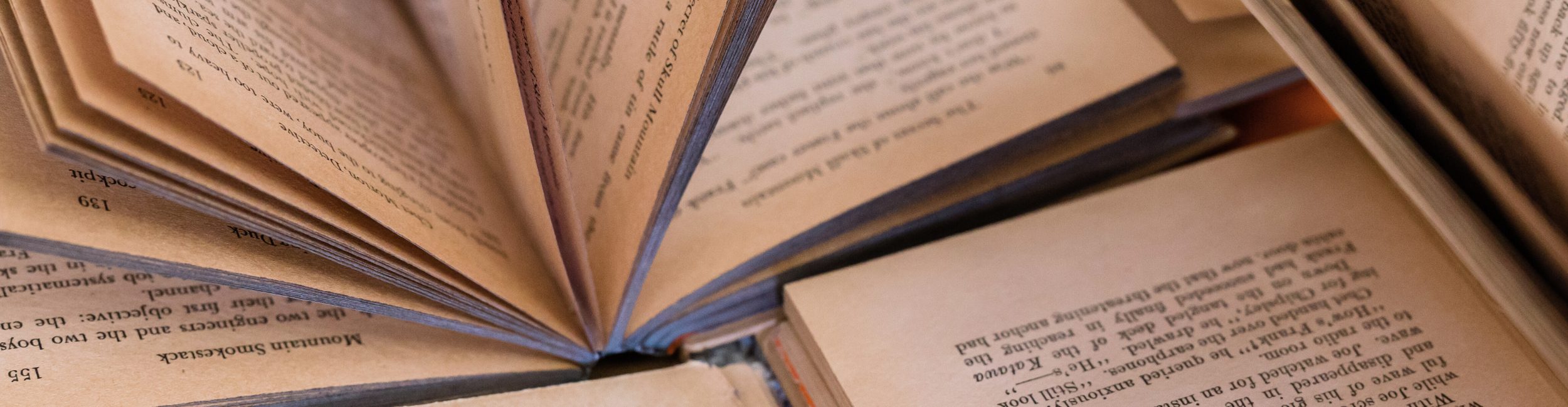 Open books on top of each other