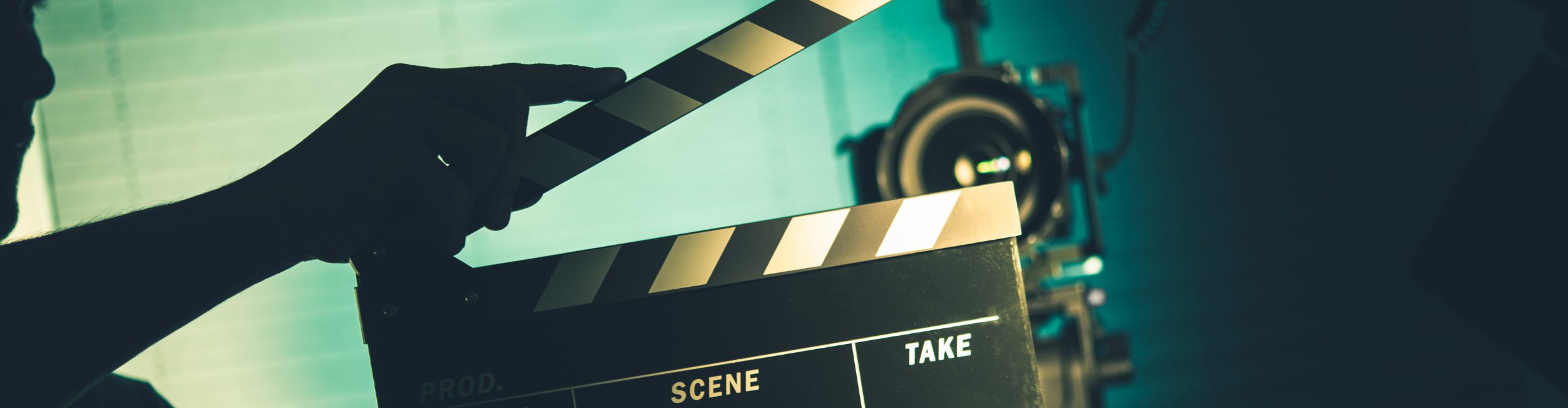 A person holding a clapperboard