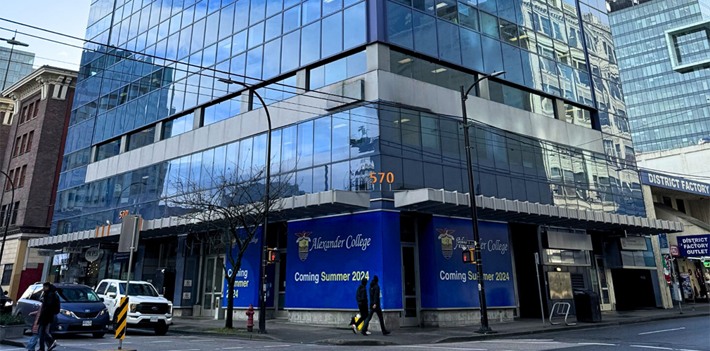 Alexander College Vancouver campus with a coming soon sign