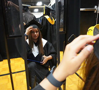 student getting ready for convocation