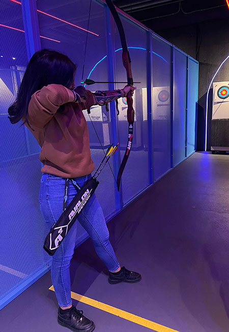 Linda shooting an arrow