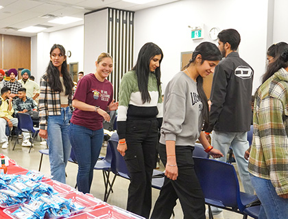 students (and volunteers) playing musical chairs