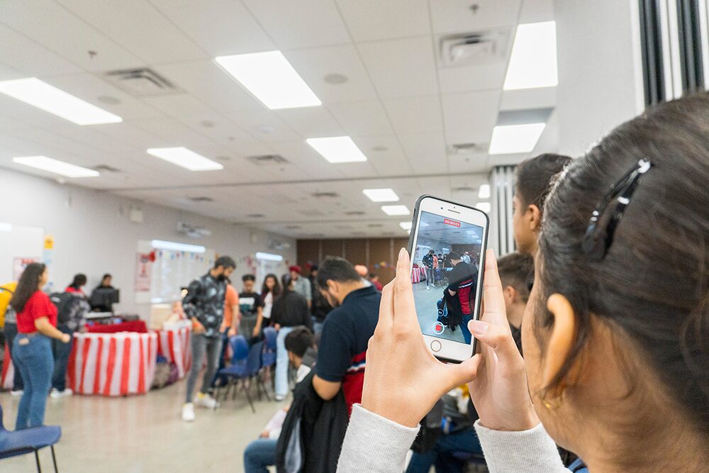student filming activities