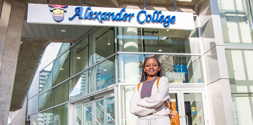 Racheal standing outside of Alexander College