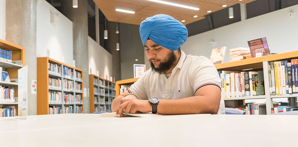 Rajveer studying in the library
