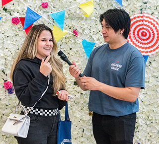 a student getting interviewed for social media