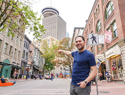 student pointing at Gastown attraction