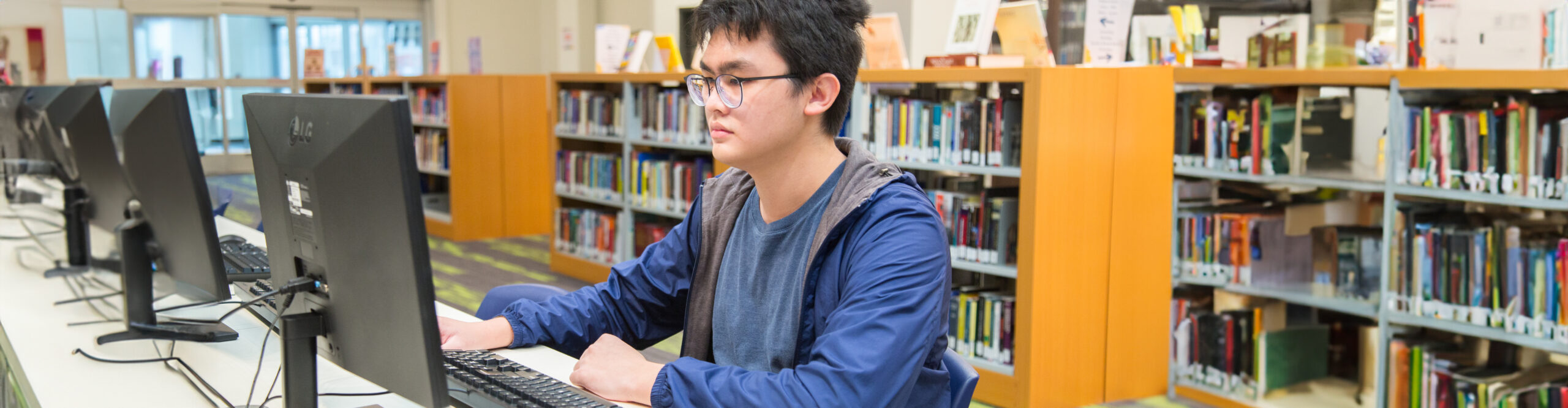 student using a computer to study
