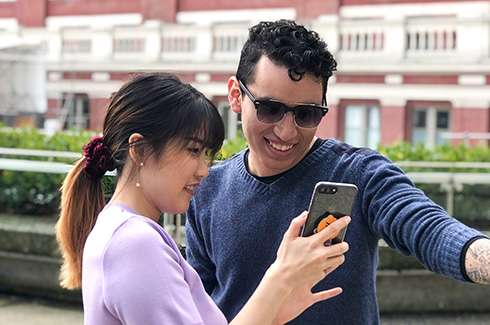 two students looking at a phone