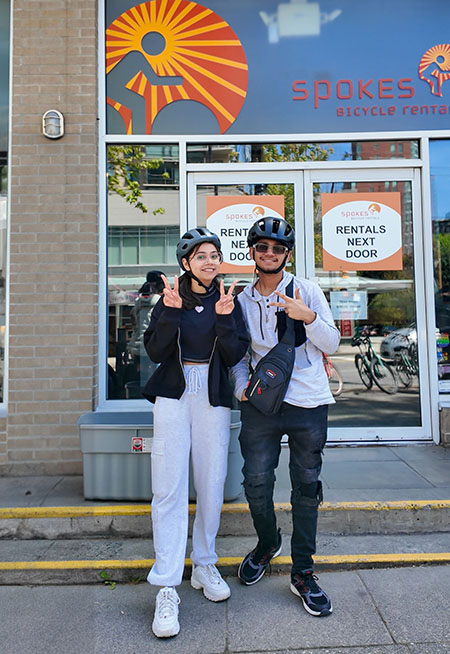 students outside Spokes Bike Rentals