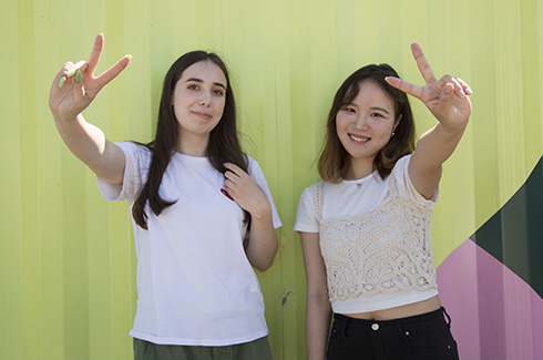 two students making a peace sign ouside Granville