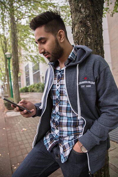 Student wearing zip up hoodie