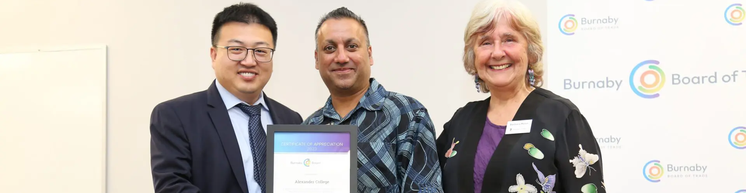 Eric, the VP of Operations and Barbara, the acting President of Alexander College being awarded a certificate of appreciation by the Buranaby Board of Trade