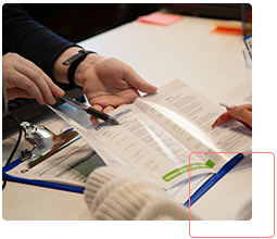 staff helping a student with a document
