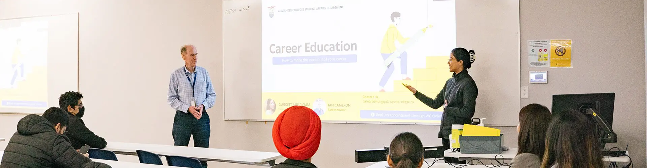 Career Advisors Ian and Gungeet giving a presentation on Career Education